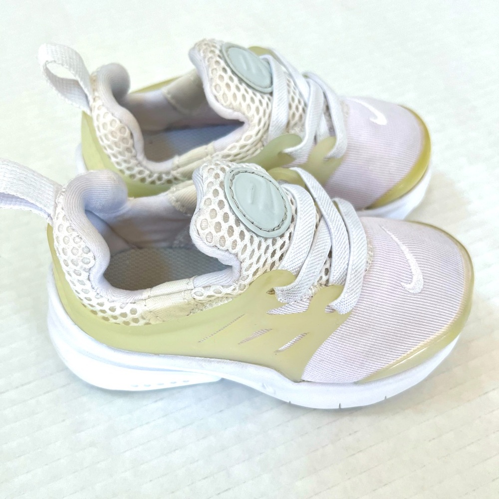 Baby Nike white and tan shoes size 5c